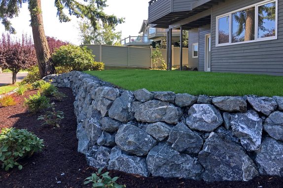 Bellingham Tiered Landscape with Natural Rock Wall, Planter Bed, and New Lawn